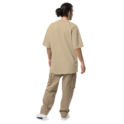 Rear view of man wearing tan t-shirt.