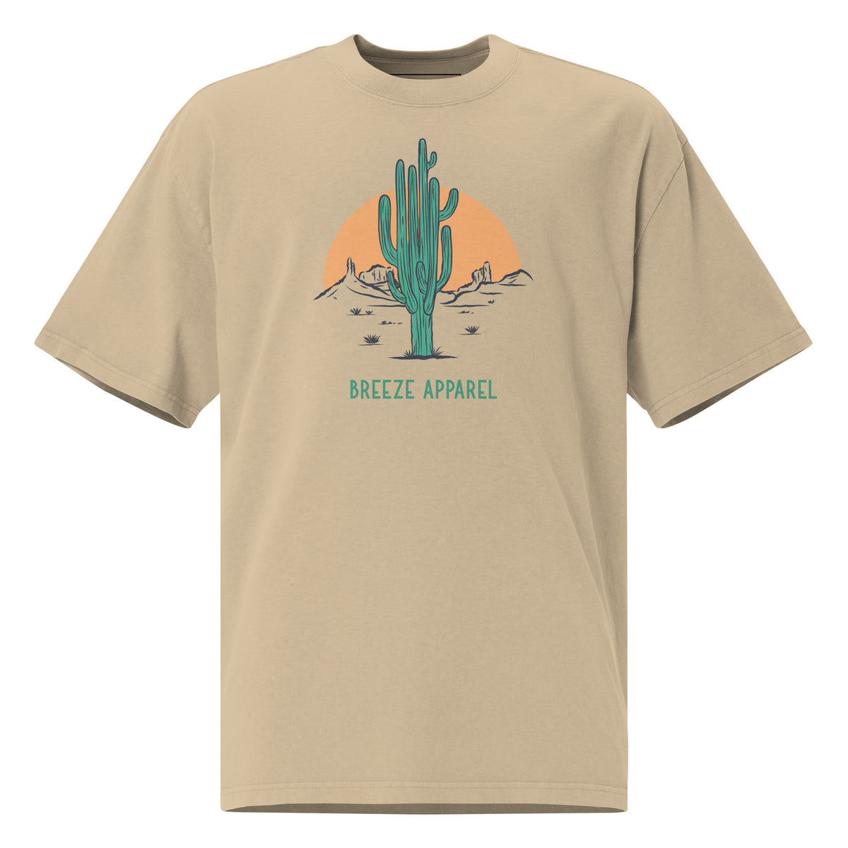 Tan t-shirt with graphic of cactus and sunset.