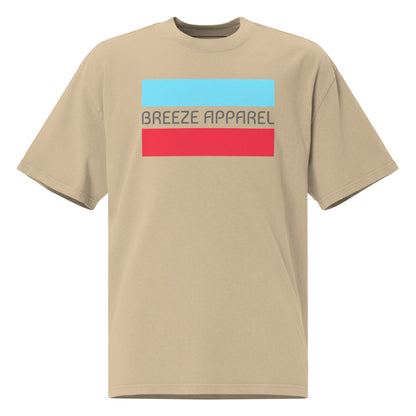 Tan t-shirt with graphic of gray lettering between light-blue and red stripes.