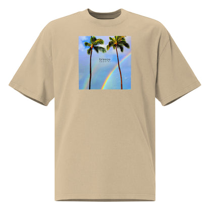Tan t-shirt with graphic of two palm trees with rainbow in background.