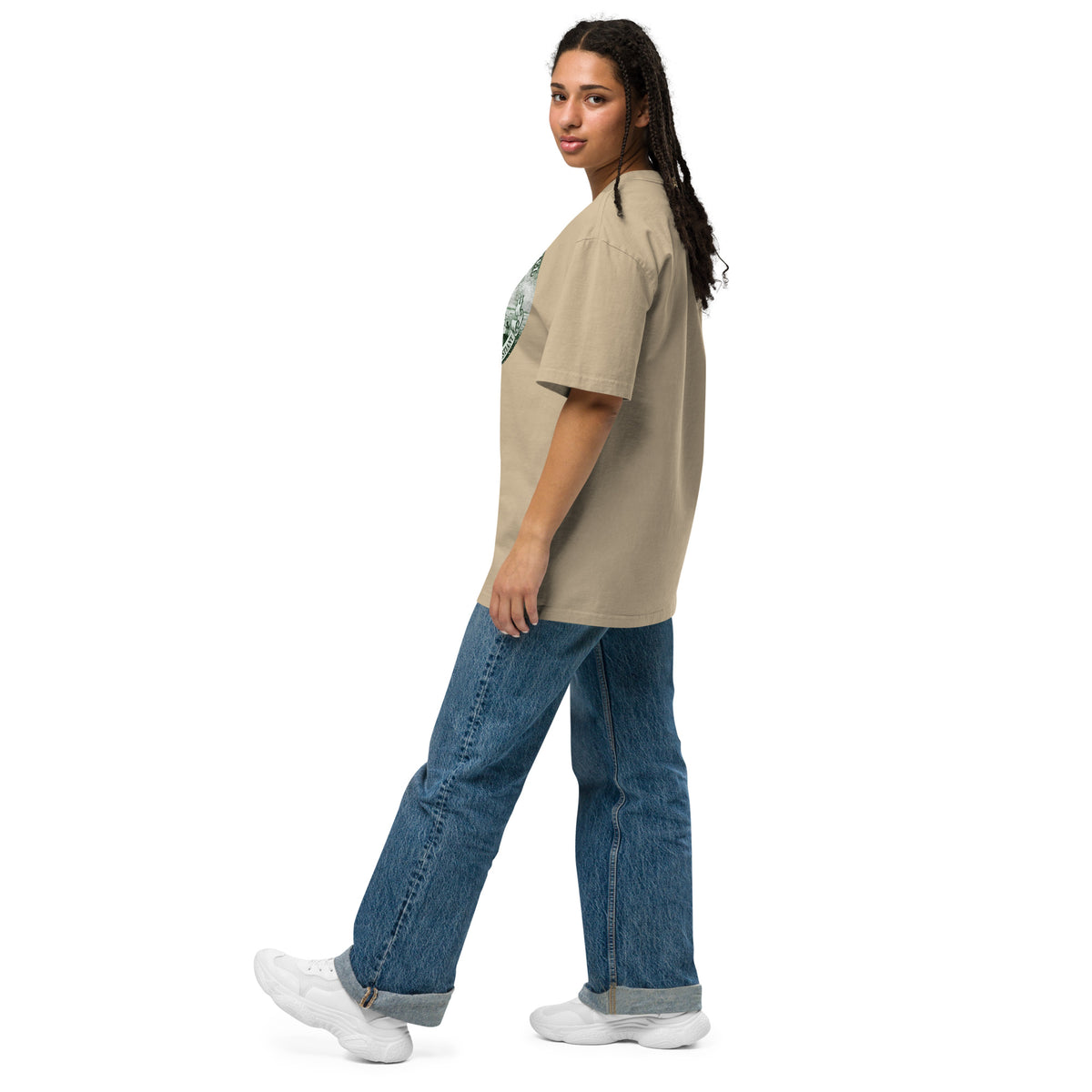 Side view of woman wearing beige oversized t-shirt.
