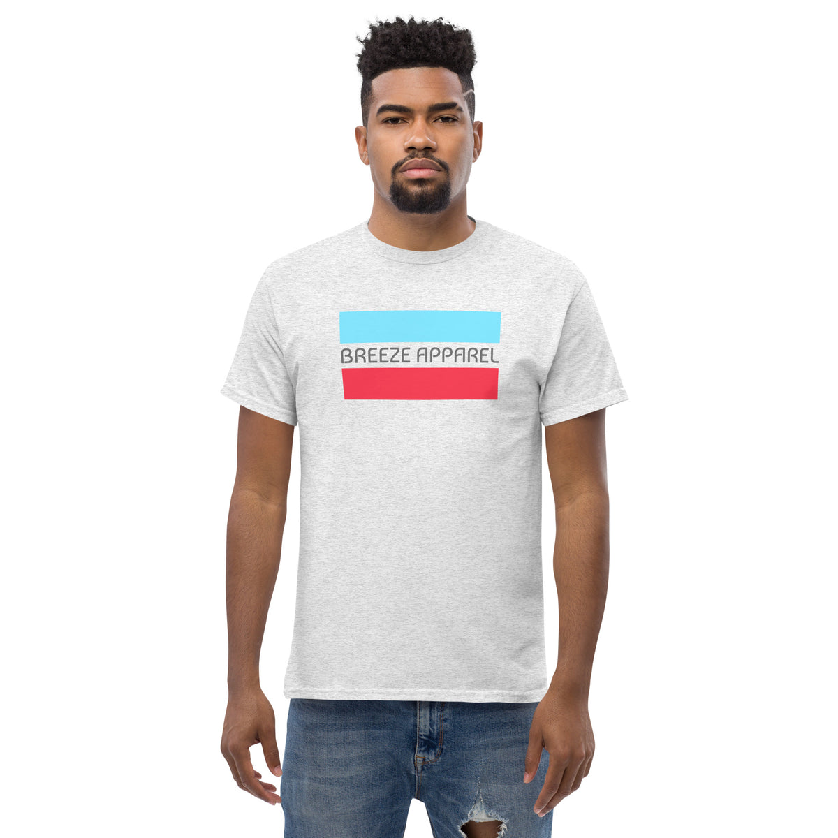 Man wearing ash-gray t-shirt with gray 'Breeze Apparel' logo between horizontal bars, the top being light blue and the bottom being red