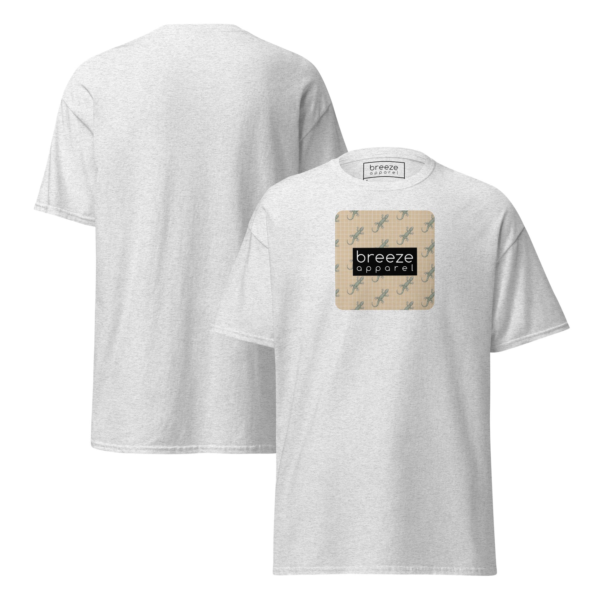 Light-gray t-shirt with square over chest that contains pattern of green geckos set on beige background, overlaid with black, rectangular logo with white lettering. Plain backside also shown.