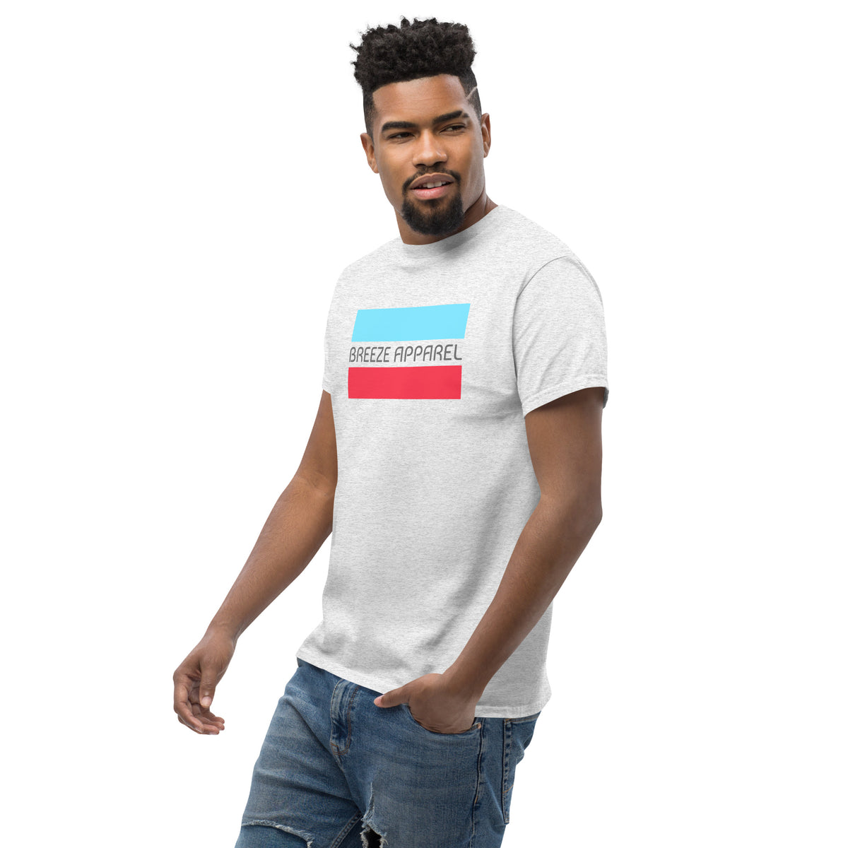 Man wearing ash-gray t-shirt with gray 'Breeze Apparel' logo between horizontal bars, the top being light blue and the bottom being red
