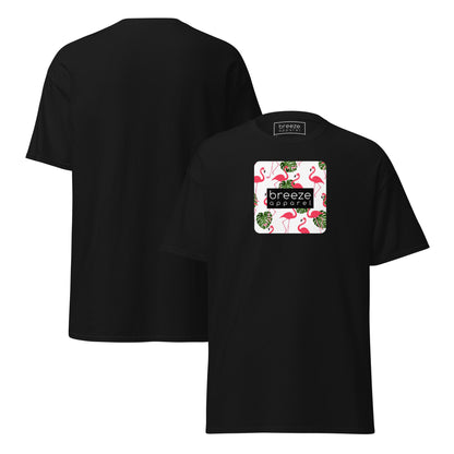 Black t-shirt with pattern of flamingos inside of a square, overlaid with a black box with 'breeze apparel' in white inside. Plain backside also shown.