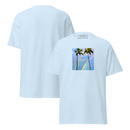 Light-blue t-shirt with a graphic of palm trees, rainbow, and a clear blue sky in the background. A small, black 'breeze apparel' logo is between the trees. Plain backside also shown.