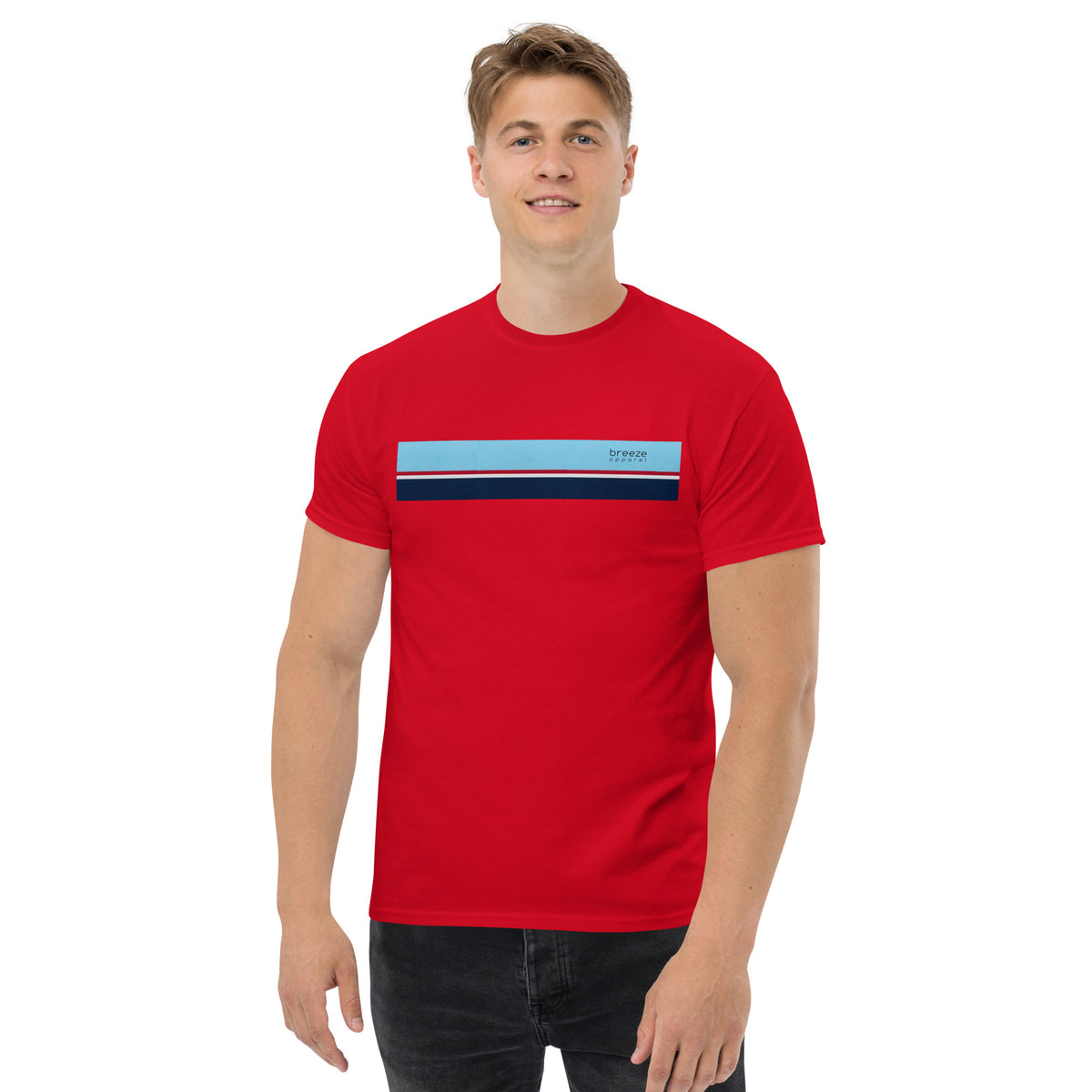 Man wearing red t-shirt with horizontal blue, red, white, and navy stripe with small black 'breeze apparel' logo.