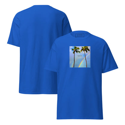 Royal-blue t-shirt with a graphic of palm trees, rainbow, and a clear blue sky in the background. A small, black 'breeze apparel' logo is between the trees. Plain backside also shown.