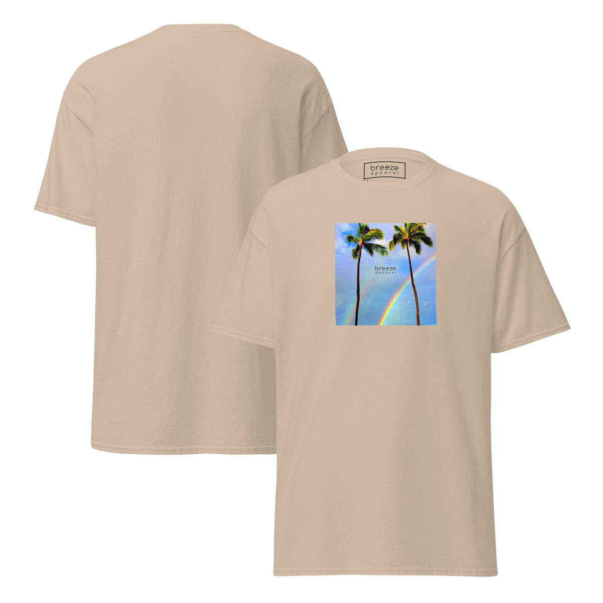 Sand t-shirt with a graphic of palm trees, rainbow, and a clear blue sky in the background. A small, black 'breeze apparel' logo is between the trees. Plain backside also shown.