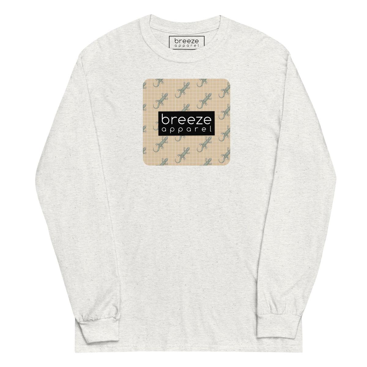 White, long-sleeved shirt with square over chest that contains pattern of green geckos set on beige background, overlaid with black, rectangular logo with white lettering.