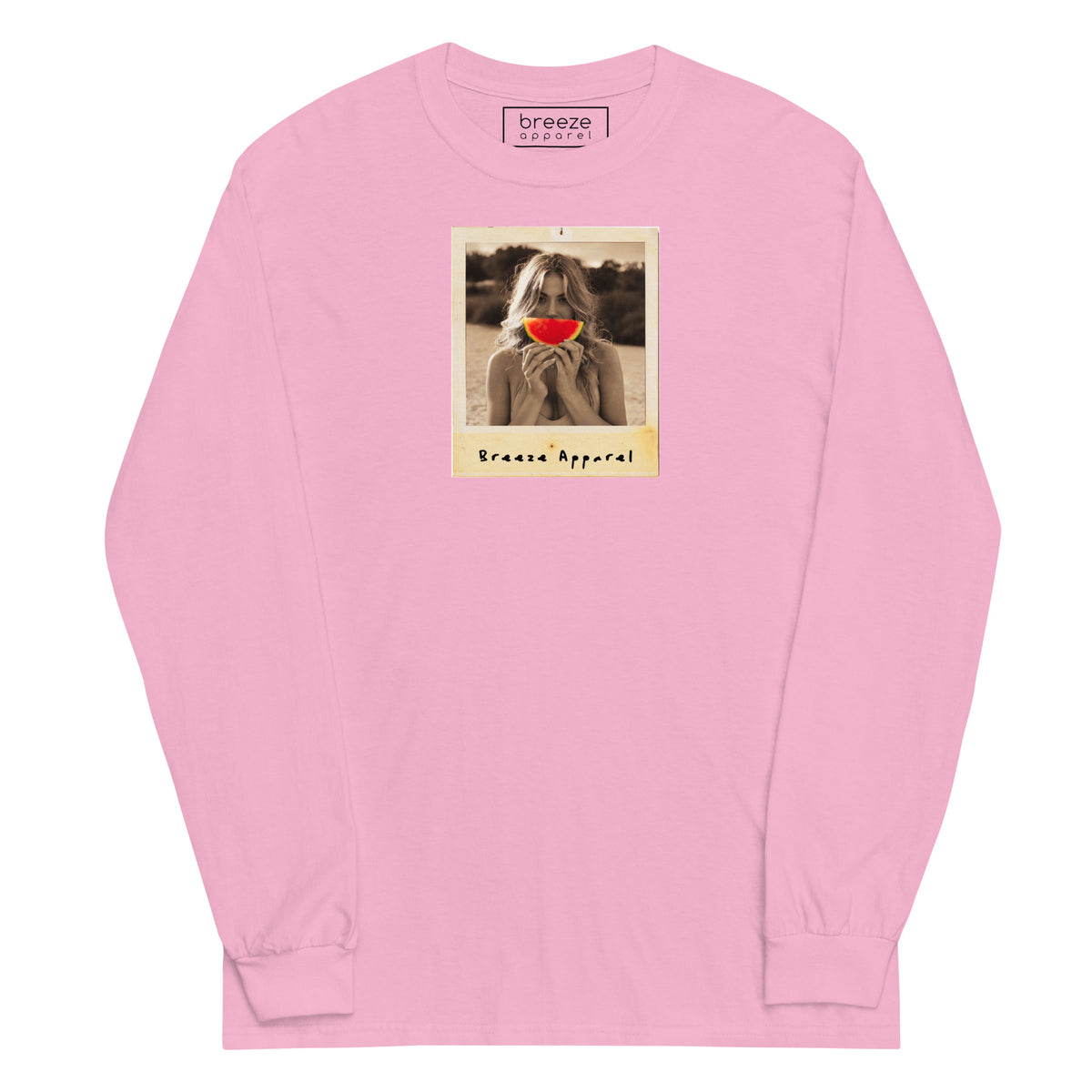 Pink long-sleeved shirt with graphic of woman holding a watermelon slice in front of her mouth.