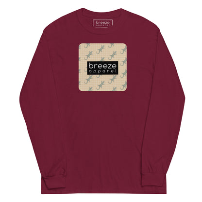 Maroon, long-sleeved shirt with square over chest that contains pattern of green geckos set on beige background, overlaid with black, rectangular logo with white lettering.