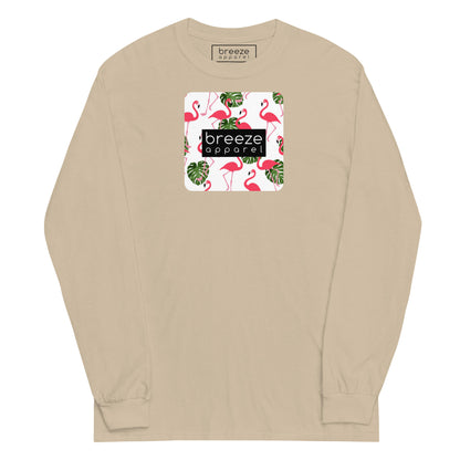 Beige long-sleeved shirt with pattern of flamingos inside of a square, overlaid with a black box with 'breeze apparel' in white inside.