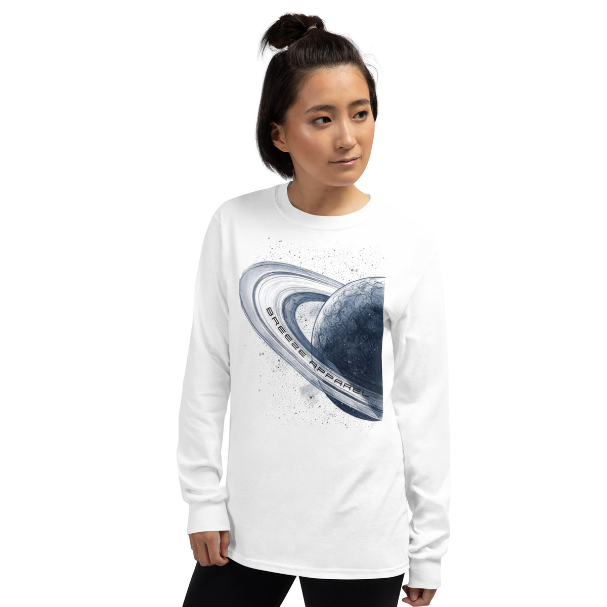 Woman wearing white, long-sleeved shirt with graphic of blue planet.