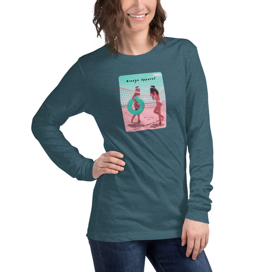 Woman wearing teal long-sleeved shirt with colorful graphic of two women on the beach.
