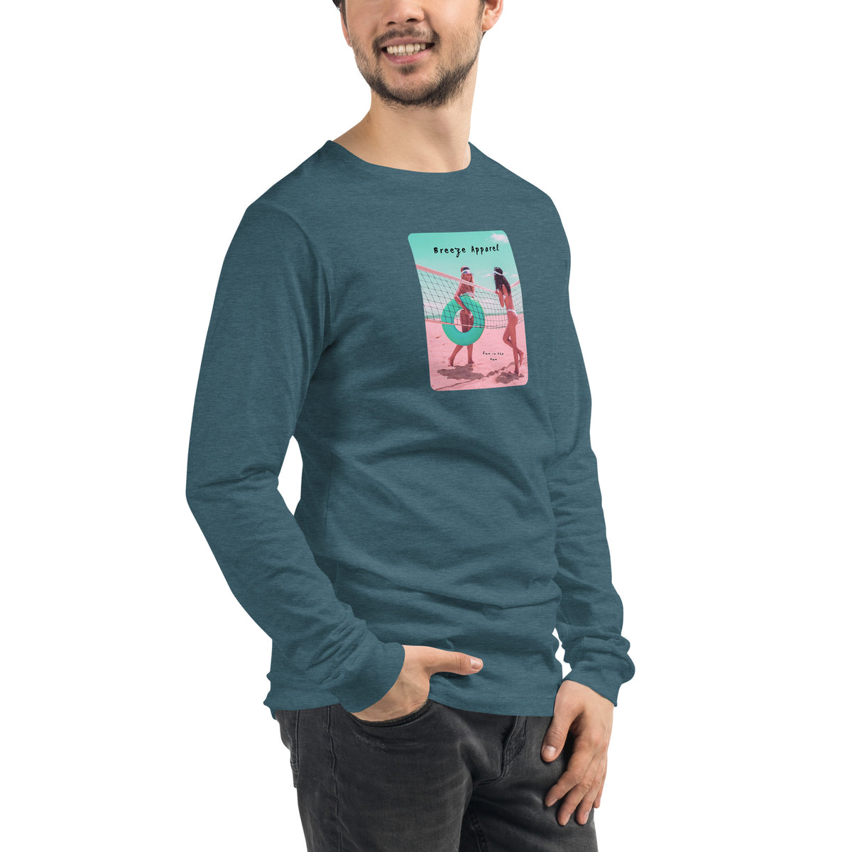 Man wearing teal long-sleeved shirt with colorful graphic of two women on the beach.