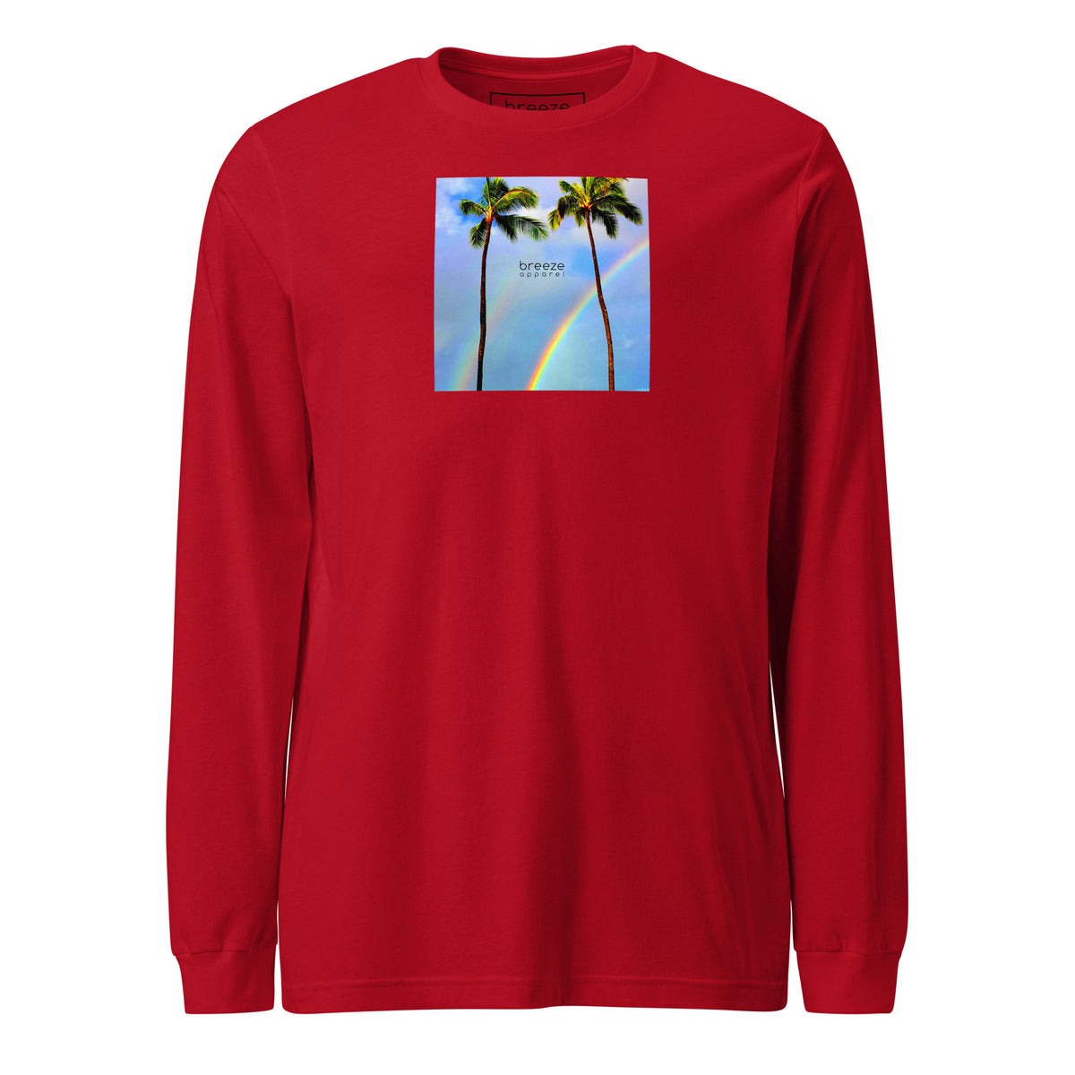 Red long-sleeved shirt with a graphic of palm trees, rainbow, and a clear blue sky in the background. A small, black 'breeze apparel' logo is between the trees.