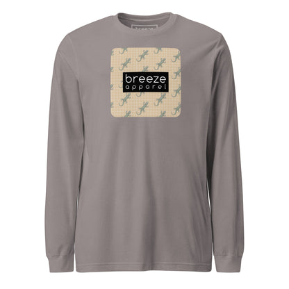 Gray, long-sleeved shirt with square over chest that contains pattern of green geckos set on beige background, overlaid with black, rectangular logo with white lettering.