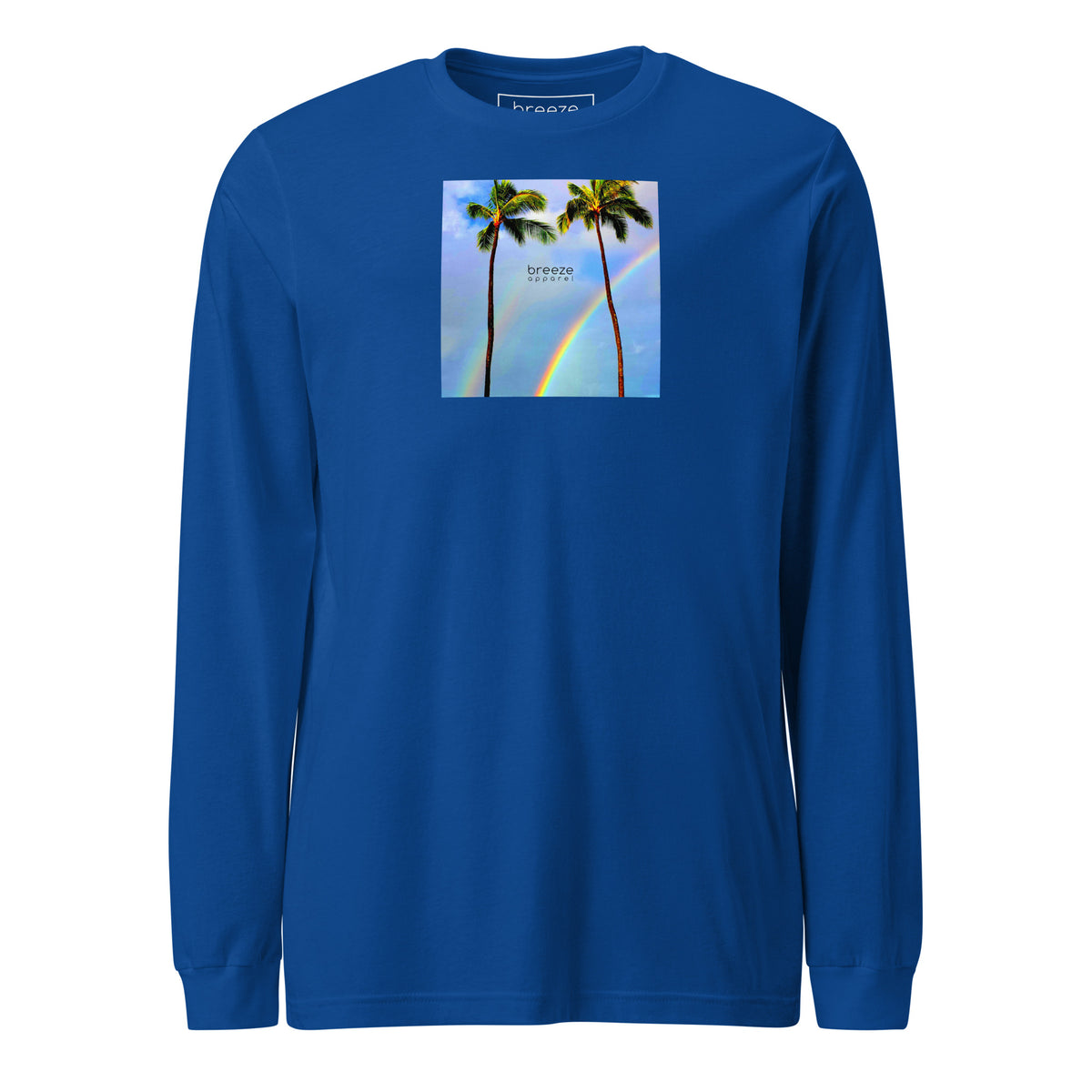 Royal-blue long-sleeved shirt with a graphic of palm trees, rainbow, and a clear blue sky in the background. A small, black 'breeze apparel' logo is between the trees.