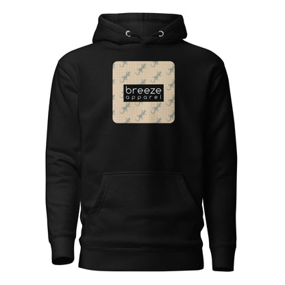 Black hoodie with square over chest that contains pattern of green geckos set on beige background, overlaid with black, rectangular logo with white lettering.
