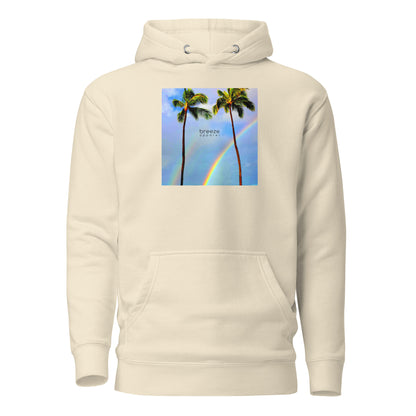 Beige hoodie with graphic of palm trees with rainbows in the background.