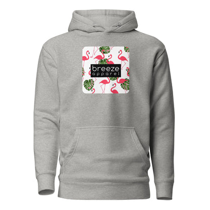 Gray hoodie with graphic of flamingos and green palm leaves set on a white background and overlaid with a black, rectangular logo.