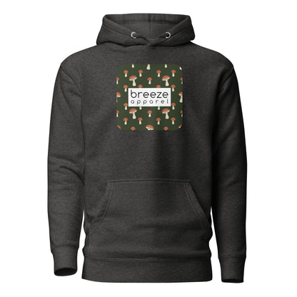 Gray hoodie with graphic of mushrooms set on a green background and overlaid with a white, rectangular logo.