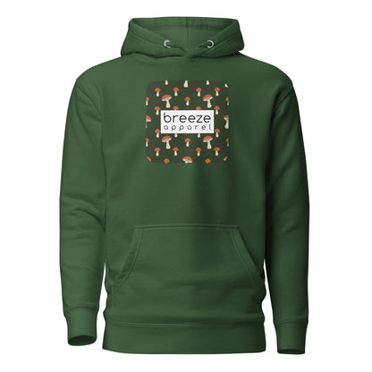 Green hoodie with graphic of mushrooms set on a green background and overlaid with a white, rectangular logo.