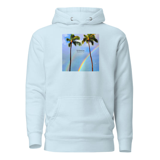 Light-blue hoodie with graphic of palm trees with rainbows in the background.