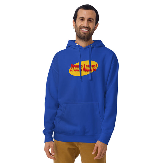 Man wearing blue hoodie with graphic of red lettering set over a yellow oval.