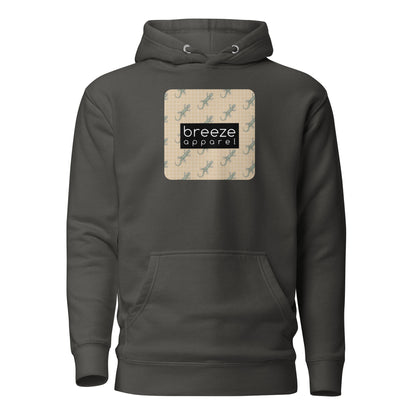 Gray hoodie with square over chest that contains pattern of green geckos set on beige background, overlaid with black, rectangular logo with white lettering.