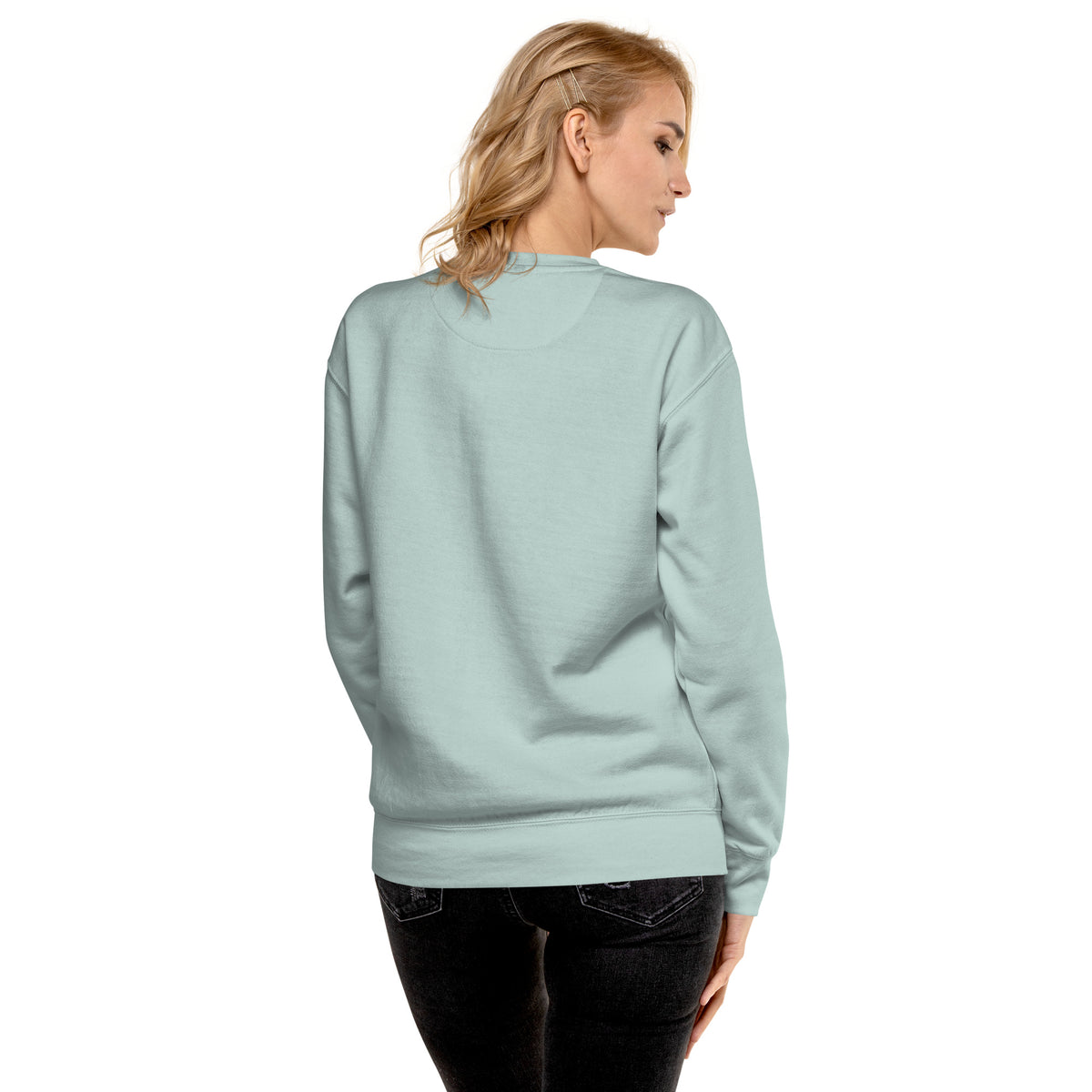 Rear view of woman wearing silver-blue sweatshirt.