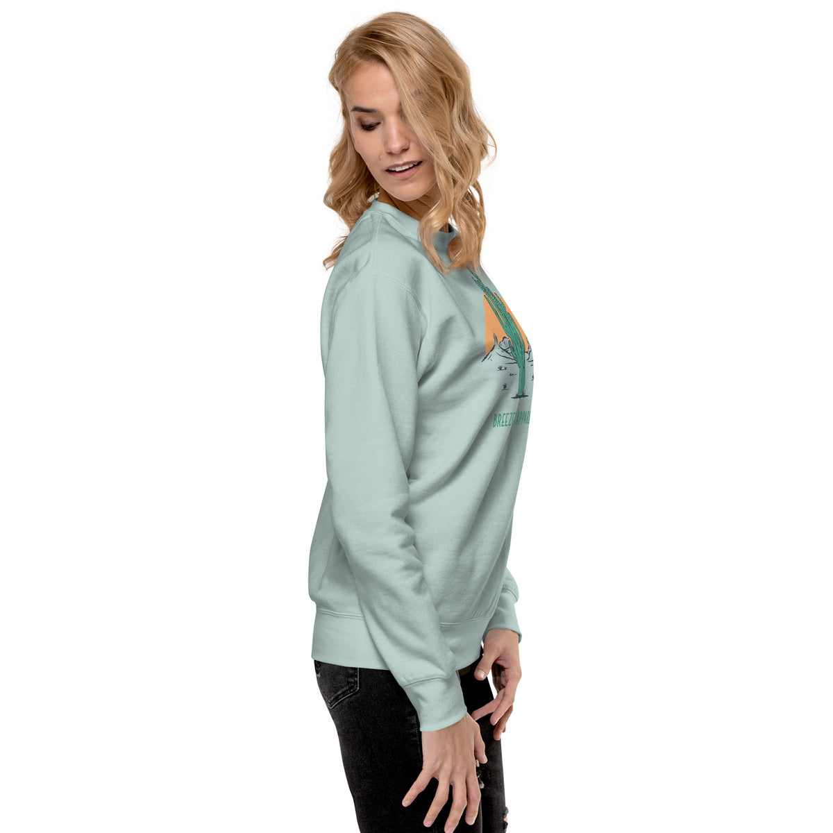 Side view of woman wearing silver-blue sweatshirt.