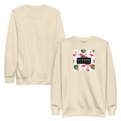 Beige sweatshirt with square graphic of flamingos and green palm leaves set on a white background and overlaid with a black, rectangular logo. Plain back of shirt also shown.