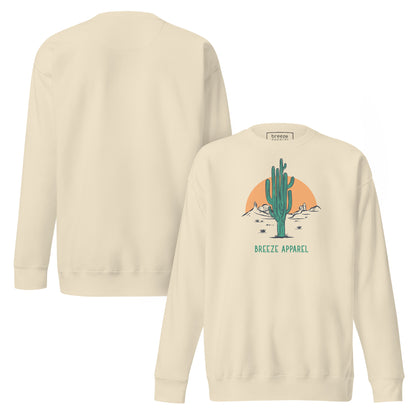 Beige sweatshirt with graphic of cactus and sun. Plain back also shown.