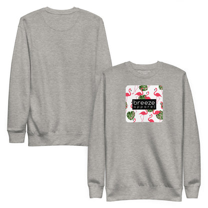 Gray sweatshirt with square graphic of flamingos and green palm leaves set on a white background and overlaid with a black, rectangular logo. Plain back of shirt also shown.