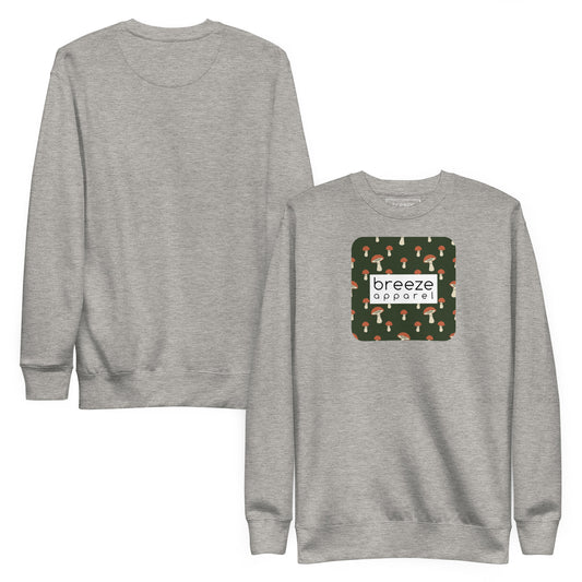 Gray sweatshirt with square graphic of mushrooms set on a green background and overlaid with a white, rectangular logo. Plain back also shown.