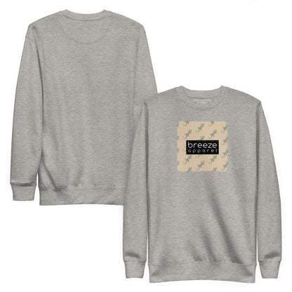 Gray sweatshirt with square over chest that contains pattern of green geckos set on beige background, overlaid with black, rectangular logo with white lettering. Plain back also shown.