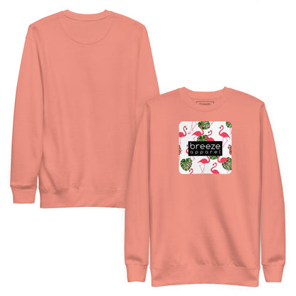 Pink sweatshirt with square graphic of flamingos and green palm leaves set on a white background and overlaid with a black, rectangular logo. Plain back of shirt also shown.
