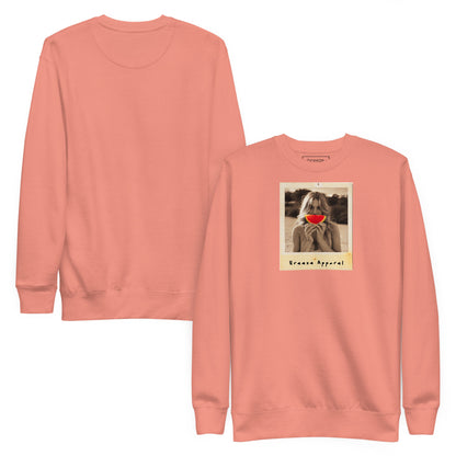 Pink sweatshirt with graphic of woman holding slice of watermelon in front of her mouth. Plain back also shown.