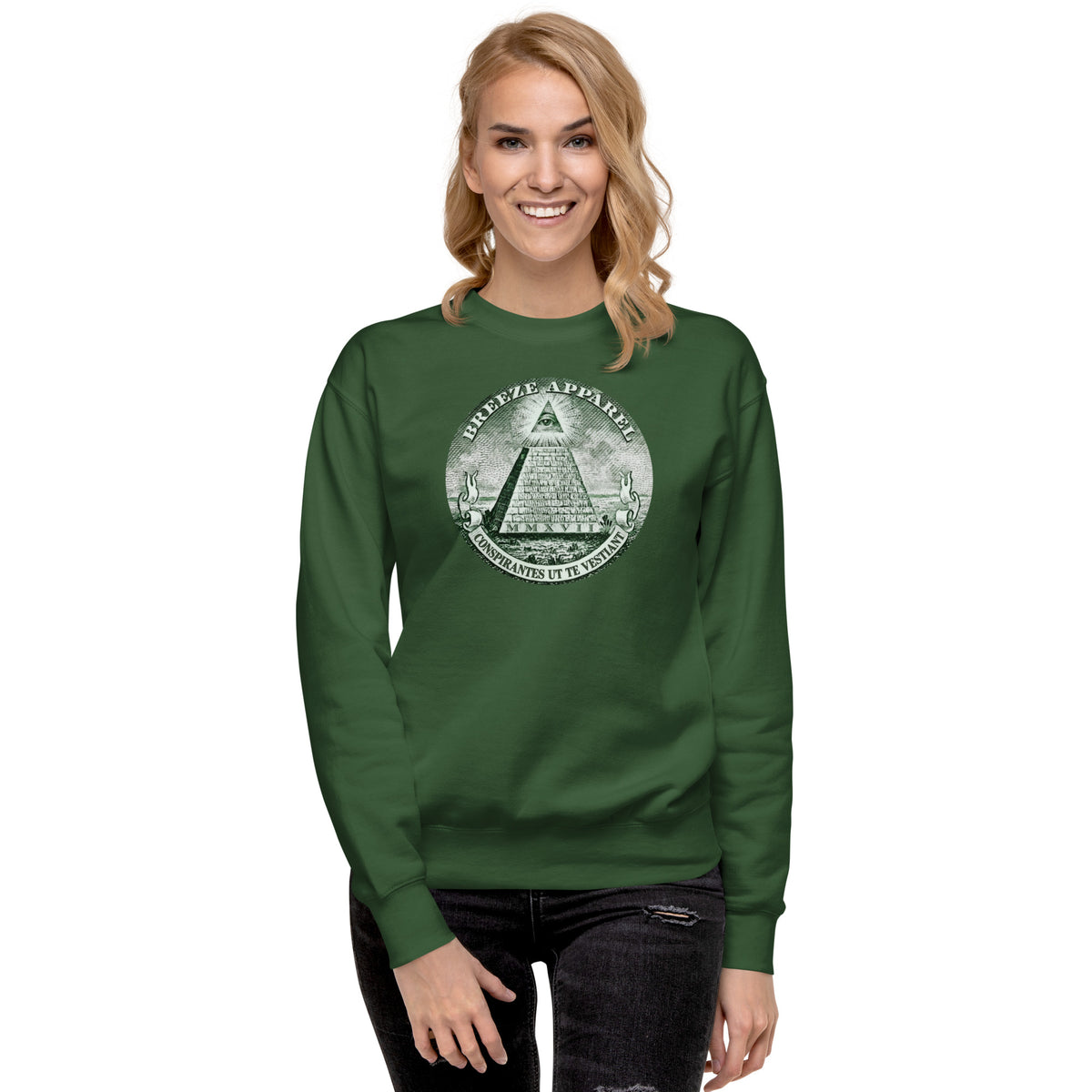 Woman wearing green sweatshirt with graphic of pyramid resembling that on the US one-dollar bill.