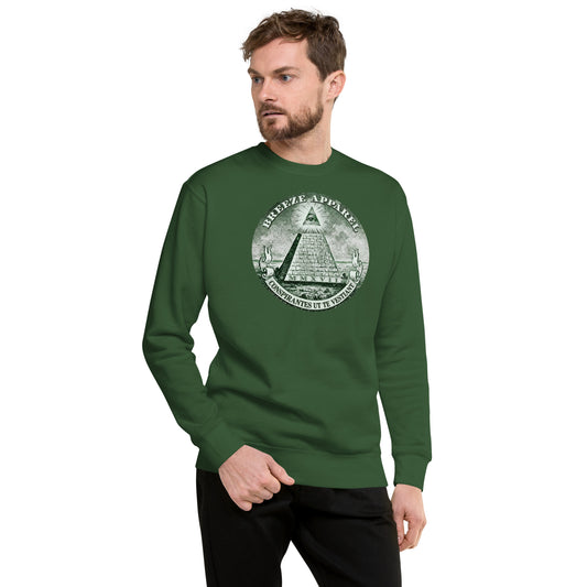 Man wearing green sweatshirt with graphic of pyramid resembling that on the US one-dollar bill.