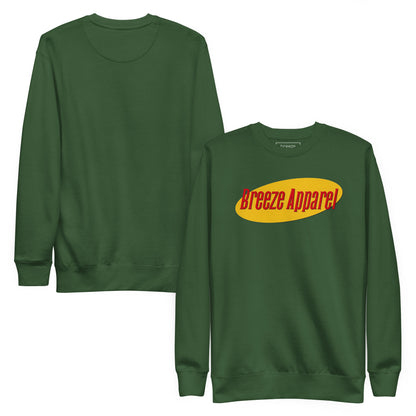 Green sweatshirt with graphic of red lettering set on a yellow oval. Plain backside also shown.