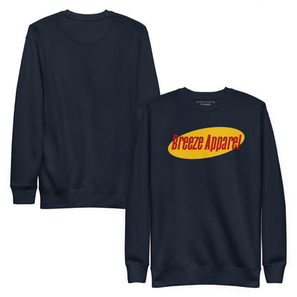 Navy sweatshirt with graphic of red lettering set on a yellow oval. Plain backside also shown.