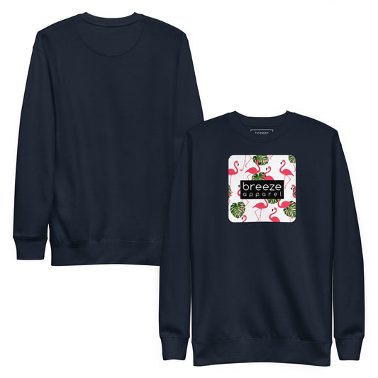 Navy sweatshirt with square graphic of flamingos and green palm leaves set on a white background and overlaid with a black, rectangular logo. Plain back of shirt also shown.