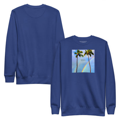 Blue sweatshirt with graphic of two palm trees with a rainbow in background. Plain back of shirt also shown.