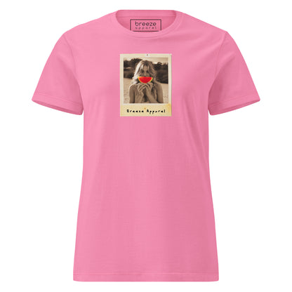 Pink t-shirt with graphic of woman holding watermelon slice in front of her mouth.