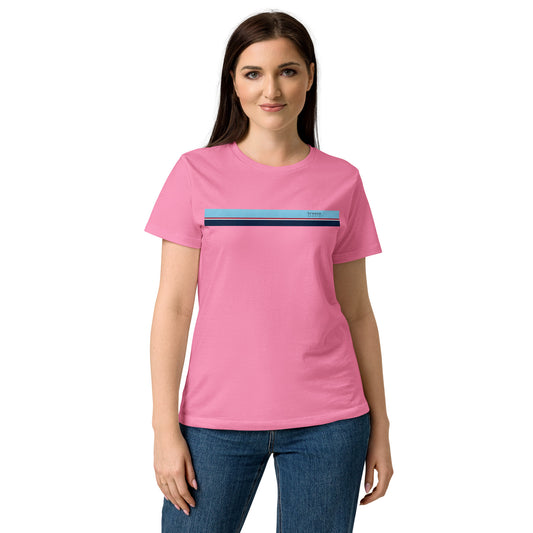 Woman wearing pink t-shirt with stripe that is light blue, red, white, and navy across chest.