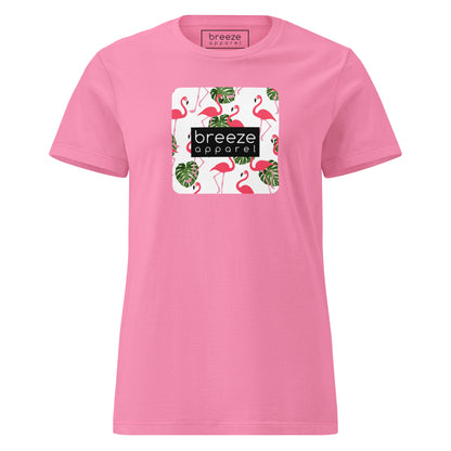 Pink t-shirt with graphic of flamingos overlaid with a black logo.