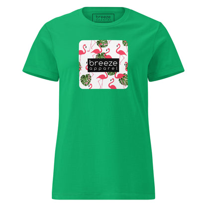 Green t-shirt with graphic of flamingos overlaid with a black logo.
